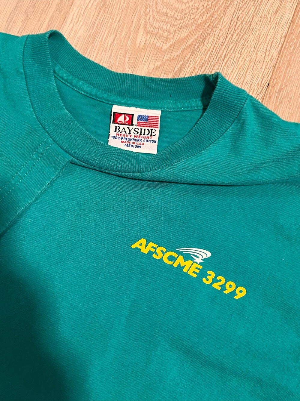 AFSCME 3299 “We Run UC” turquoise bayside made in USA tee
